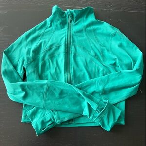 Emerald green full zip cropped jacket.